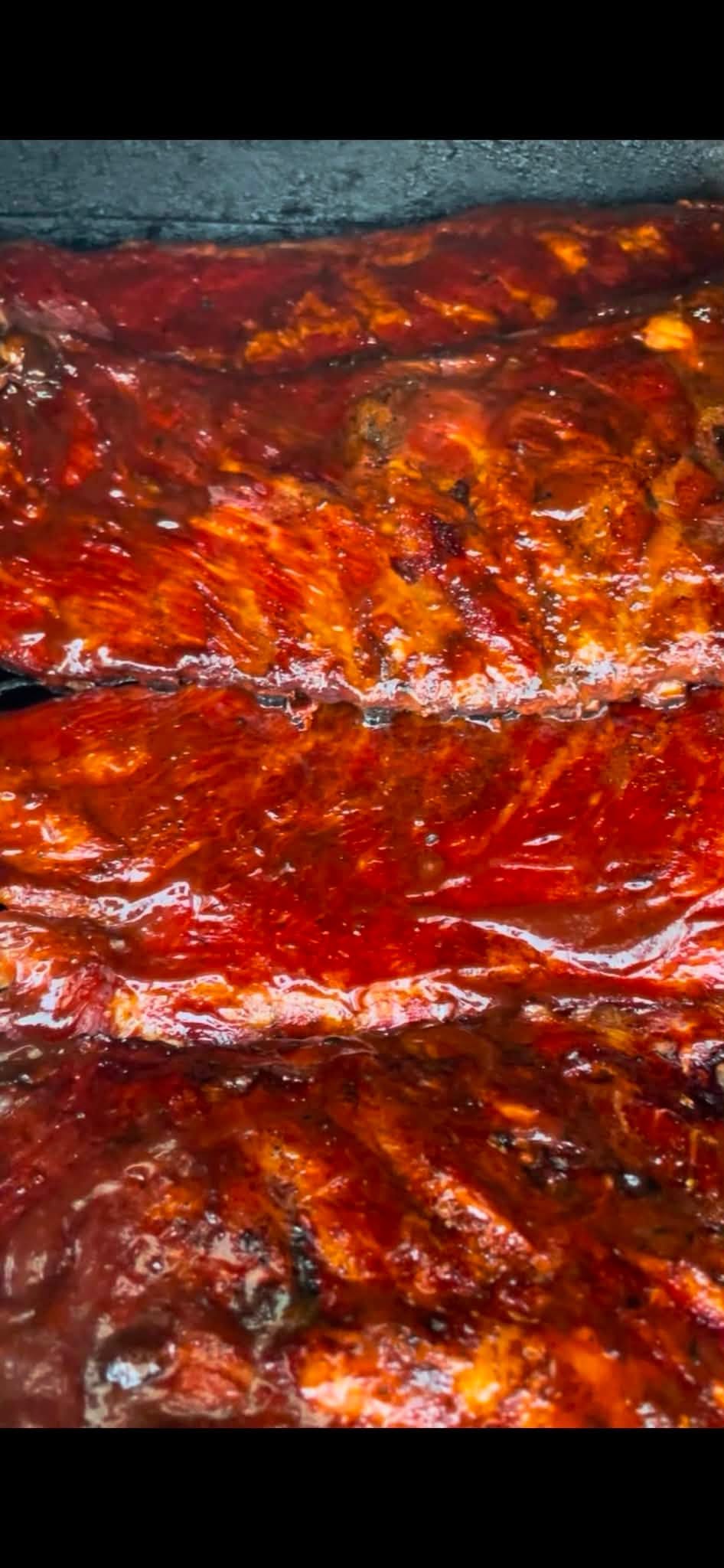 Close-up of saucy smoked meat dish